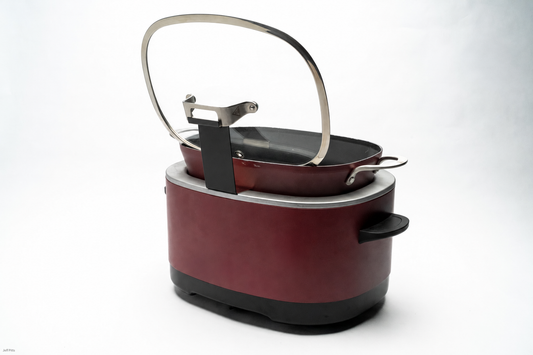 Black Ninja Lid Daddy holding the glass lid on a burgundy cooker
